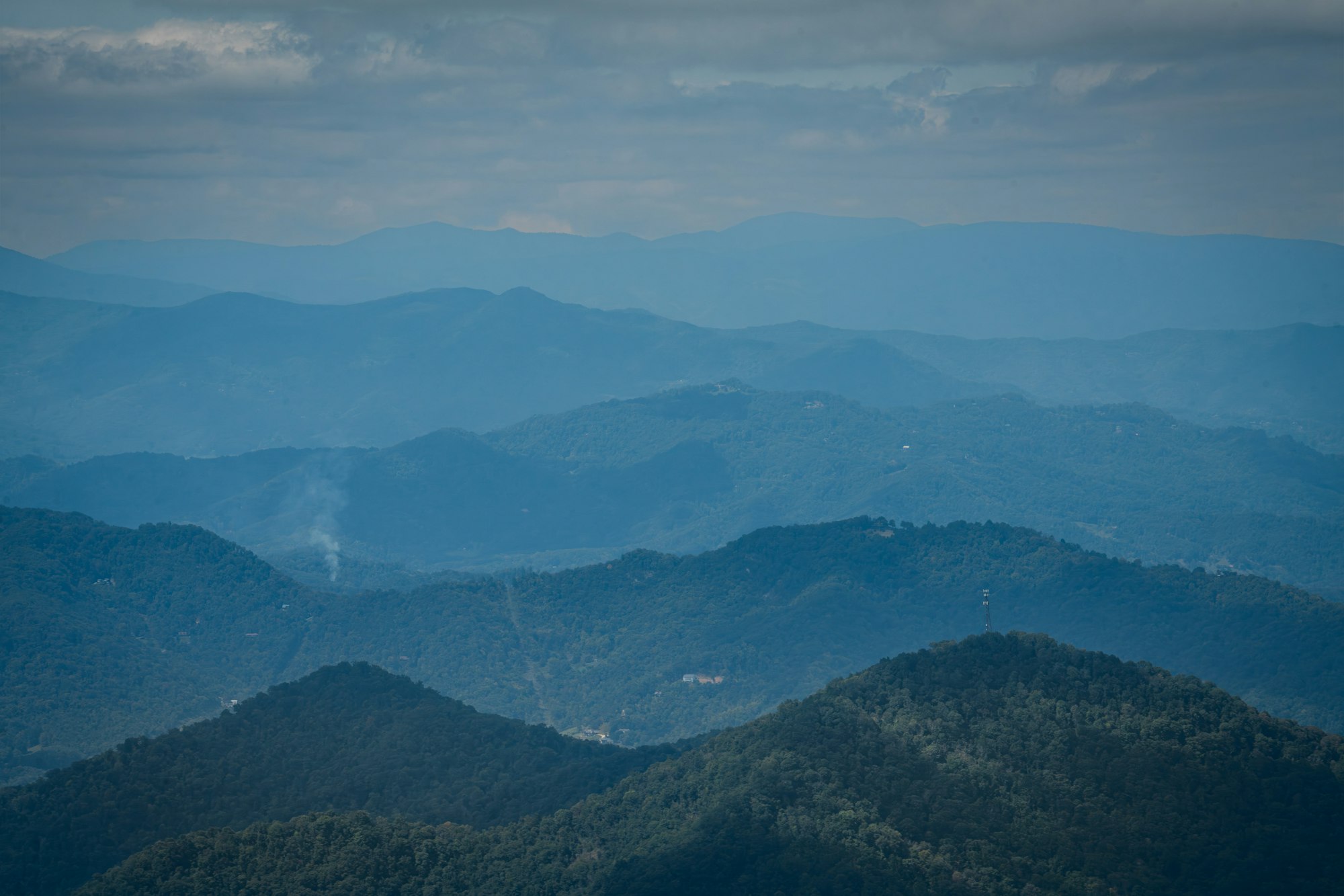 Layered Appalachian ridgelines under a cloudy sky